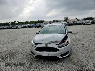 2018 Ford Focus SE with VIN 1FADP3F28JL256318, listed as a Copart auction lot 55524544 with 136,723 mi miles and Salvage title. Bid and sale history available at DreamBid. Image 10.