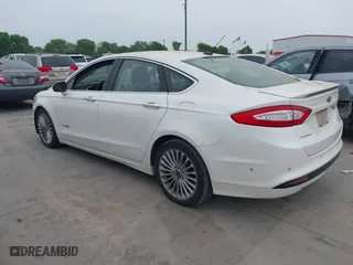 2014 Ford Fusion Titanium Hybrid with VIN 3FA6P0RU6ER115985, listed as a IAAI auction lot 41870494 with 132,321 mi miles. Bid and sale history available at carsss.com. Image 3.
