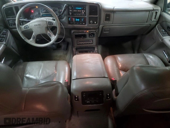2005 GMC Yukon Denali z VIN 1GKEK63U45J222600, wystawiony jako Copart lot #51329775 z przebiegiem 287 293 mil mil oraz Czysty tytuł • Clean title. Historia ofert i sprzedaży dostępna na DreamBid. Obrazek 8.