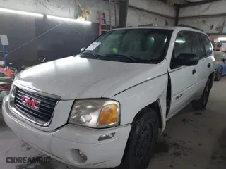 2004 GMC Envoy SLE with VIN 1GKDS13S642118163, listed as a IAAI auction lot 41809472 with 234,353 mi miles. Bid and sale history available at carsss.com. Image 2.
