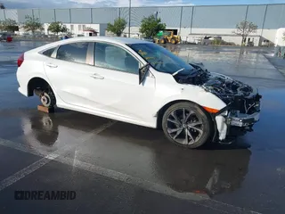 2019 Honda Civic Sport with VIN 19XFC2F86KE215368, listed as a IAAI auction lot 41934715 with 50,253 mi miles and . Bid and sale history available at DreamBid. Image 1.
