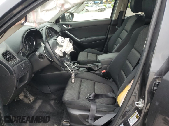 2014 Mazda CX-5 Touring z VIN JM3KE4CY2E0368729, wystawiony jako Copart lot #55563645 z przebiegiem 204 521 mil mil oraz Szkoda całkowita • Salvage title. Historia ofert i sprzedaży dostępna na DreamBid. Obrazek 7.