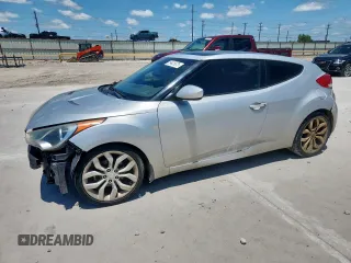 2013 Hyundai Veloster w/Black Int z VIN KMHTC6AD9DU142253, wystawiony jako Copart lot #59425675 z przebiegiem 233 756 mil mil oraz Czysty tytuł • Clean title. Historia ofert i sprzedaży dostępna na DreamBid. Obrazek 1.