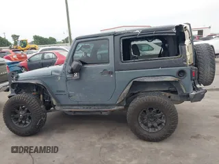 2015 Jeep Wrangler Sport with VIN 1C4GJWAG7FL585631, listed as a IAAI auction lot 41943582 with 88,649 mi miles and . Bid and sale history available at DreamBid. Image 14.