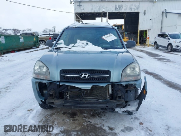 2006 Hyundai Tucson GL with VIN KM8JM72B06U298904, listed as a IAAI auction lot 41370728 with 209,284 mi miles. Bid and sale history available at carsss.com. Image 12.