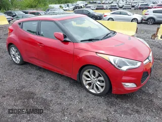 2013 Hyundai Veloster w/Black Int with VIN KMHTC6ADXDU111156, listed as a IAAI auction lot 42659181 with 74,715 mi miles and . Bid and sale history available at DreamBid. Image 1.