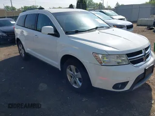 2012 Dodge Journey SXT z VIN 3C4PDCBG7CT181314, wystawiony jako IAAI lot #42265874 z przebiegiem 193 852 mil mil oraz . Historia ofert i sprzedaży dostępna na DreamBid. Obrazek 1.
