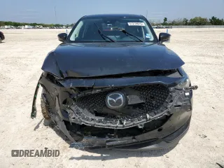 2021 Mazda CX-5 Grand Touring with VIN JM3KFADM5M0479247, listed as a Copart auction lot 51219915 with 33,384 mi miles and Salvage Title. Bid and sale history available at carsss.com. Image 5.