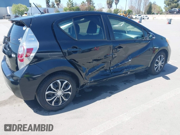 2012 Toyota Prius c One with VIN JTDKDTB36C1527223, listed as a IAAI auction lot 42002927 with 138,176 mi miles. Bid and sale history available at carsss.com. Image 4.