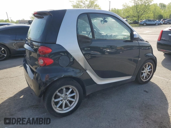 2009 Smart fortwo Pure z VIN WMEEJ31X39K211342, wystawiony jako Copart lot #54104045 z przebiegiem 46 162 mil mil oraz Tytuł czysty. Historia ofert i sprzedaży dostępna na DreamBid. Obrazek 3.