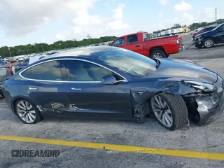 2020 Tesla Model 3 Standard Range Plus with VIN 5YJ3E1EA0LF744046, listed as a IAAI auction lot 41939894 with 102,576 mi miles. Bid and sale history available at carsss.com. Image 6.