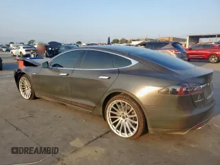 2013 Tesla Model S with VIN 5YJSA1CG0DFP15615, listed as a Copart auction lot 50795235 with 156,030 mi miles and Salvage title. Bid and sale history available at DreamBid. Image 2.