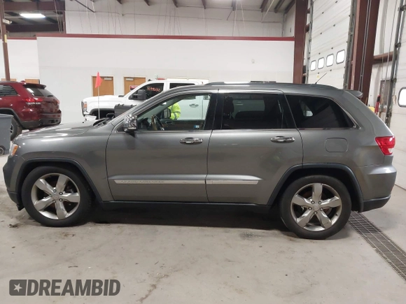 2013 Jeep Grand Cherokee Overland with VIN 1C4RJFCT9DC524605, listed as a IAAI auction lot 42016103 with 215,352 mi miles. Bid and sale history available at carsss.com. Image 14.