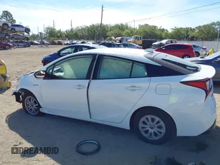 2021 Toyota Prius L Eco with VIN JTDKAMFU2M3147562, listed as a IAAI auction lot 41882066 with 99,491 mi miles. Bid and sale history available at carsss.com. Image 14.