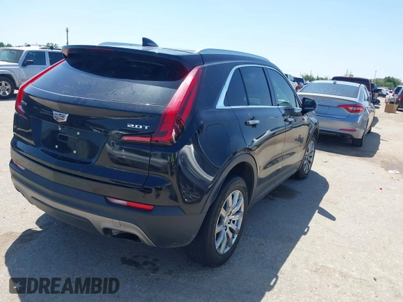 2019 Cadillac XT4 FWD Premium Luxury z VIN 1GYFZCR48KF141478, wystawiony jako IAAI lot #41988092 z przebiegiem 53 970 mil mil oraz . Historia ofert i sprzedaży dostępna na DreamBid. Obrazek 4.