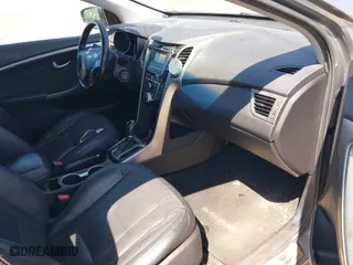 2013 Hyundai Elantra GT with VIN KMHD35LE9DU058163, listed as a IAAI auction lot 42067923 with 180,638 mi miles. Bid and sale history available at carsss.com. Image 5.