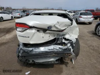 2021 Toyota Corolla Hybrid with VIN JTDBAMDE2MJ021418, listed as a Copart auction lot 52736295 with 92,061 mi miles and Salvage Title. Bid and sale history available at carsss.com. Image 6.