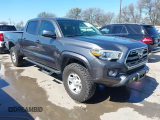 2016 Toyota Tacoma SR5 with VIN 5TFDZ5BN9GX006376, listed as a IAAI auction lot 41642238 with 142,694 mi miles. Bid and sale history available at carsss.com. Image 1.