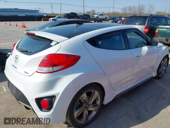 2015 Hyundai Veloster Turbo with VIN KMHTC6AE4FU234611, listed as a IAAI auction lot 42059915 with 107,388 mi miles. Bid and sale history available at carsss.com. Image 4.