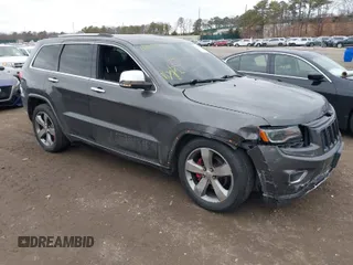 2014 Jeep Grand Cherokee Overland with VIN 1C4RJFCGXEC172008, listed as a IAAI auction lot 41719313 with 164,682 mi miles. Bid and sale history available at carsss.com. Image 1.