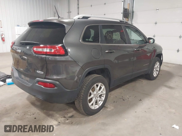2014 Jeep Cherokee Altitude with VIN 1C4PJMCB2EW317346, listed as a IAAI auction lot 41861651 with 100,602 mi miles. Bid and sale history available at carsss.com. Image 4.