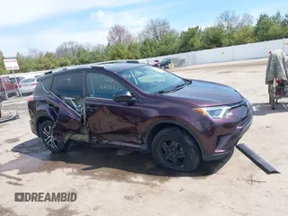 2016 Toyota RAV4 LE with VIN 2T3ZFREV8GW310580, listed as a IAAI auction lot 42063071 with 104,099 mi miles and . Bid and sale history available at DreamBid. Image 14.