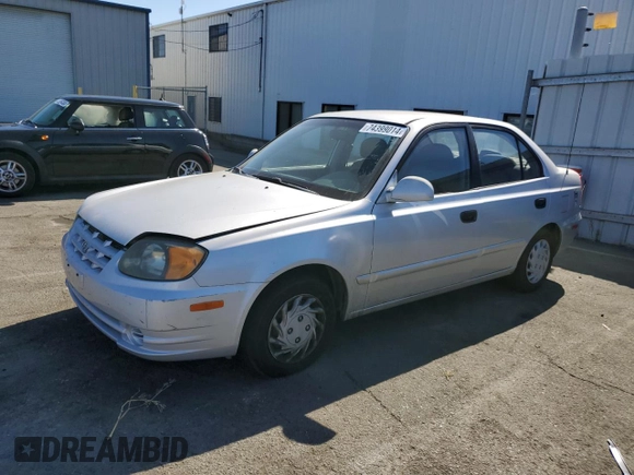 2003 Hyundai Accent GL with VIN KMHCG45CX3U488238, listed as a Copart auction lot 74399014 with 130,915 mi miles and Clean Title. Bid and sale history available at carsss.com. Image 1.