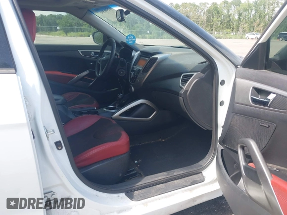 2012 Hyundai Veloster w/Gray Int z VIN KMHTC6ADXCU050034, wystawiony jako IAAI lot #42506584 z przebiegiem 142 514 mil mil oraz . Historia ofert i sprzedaży dostępna na DreamBid. Obrazek 5.