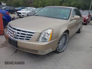 2006 Cadillac DTS 1SC z VIN 1G6KD57Y56U102470, wystawiony jako IAAI lot #40758530 z przebiegiem 149 330 mil mil oraz . Historia ofert i sprzedaży dostępna na DreamBid. Obrazek 2.