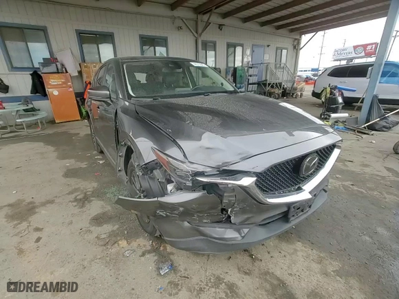 2020 Mazda CX-5 Touring with VIN JM3KFACM6L0797748, listed as a Copart auction lot 44573645 with 104,094 mi miles and Salvage Title. Bid and sale history available at carsss.com. Image 11.