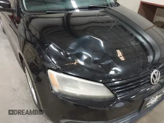 2014 Volkswagen Jetta SE with VIN 3VWD17AJ7EM409189, listed as a IAAI auction lot 42313804 with 139,950 mi miles and . Bid and sale history available at DreamBid. Image 6.