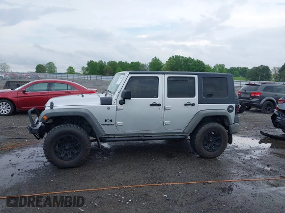 2007 Jeep Wrangler Unlimited X with VIN 1J4GA39187L209448, listed as a IAAI auction lot 42104328 with 138,302 mi miles and . Bid and sale history available at DreamBid. Image 14.