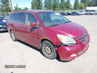 2006 Honda Odyssey Touring z VIN 5FNRL38816B096273, wystawiony jako IAAI lot #42361272 z przebiegiem 159 491 mil mil oraz . Historia ofert i sprzedaży dostępna na DreamBid. Obrazek 1.