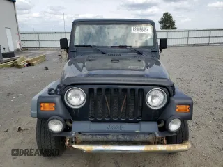 2000 Jeep Wrangler Sport z VIN 1J4FA49S9YP798353, wystawiony jako Copart lot #62009645 z przebiegiem 116 676 mil mil oraz Szkoda całkowita • Salvage title. Historia ofert i sprzedaży dostępna na DreamBid. Obrazek 5.