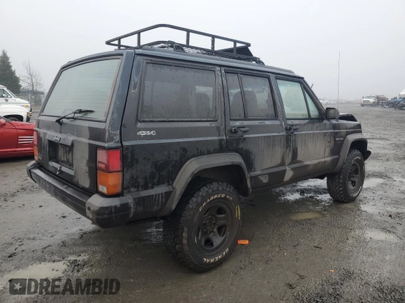 1996 Jeep Cherokee Sport with VIN 1J4FJ68S0TL288244, listed as a Copart auction lot 87801025 with 218,356 mi miles and Salvage Title. Bid and sale history available at carsss.com. Image 3.