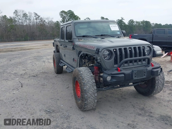 2021 Jeep Gladiator Rubicon with VIN 1C6JJTBG7ML554354, listed as a IAAI auction lot 41796943 with 61,513 mi miles and . Bid and sale history available at DreamBid. Image 1.