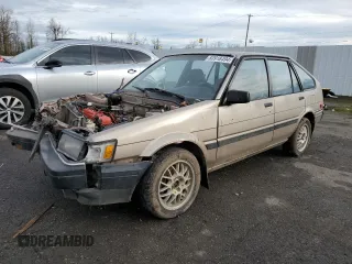 1986 Toyota Corolla with VIN JT2AE83L6G3356299, listed as a Copart auction lot 83918494 with 479,909 mi miles and Salvage title. Bid and sale history available at DreamBid. Image 1.