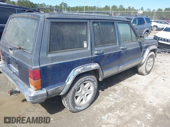 1996 Jeep Cherokee Country with VIN 1J4FT78S5TL148433, listed as a IAAI auction lot 41722054 with 276,612 mi miles and . Bid and sale history available at DreamBid. Image 4.