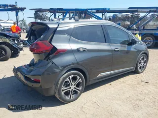 2018 Chevrolet Bolt EV Premier z VIN 1G1FX6S04J4116505, wystawiony jako IAAI lot #42258808 z przebiegiem 103 089 mil mil oraz . Historia ofert i sprzedaży dostępna na DreamBid. Obrazek 4.