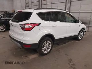 2018 Ford Escape SE z VIN 1FMCU9GD2JUB17518, wystawiony jako IAAI lot #41919245 z przebiegiem 102 626 mil mil oraz . Historia ofert i sprzedaży dostępna na DreamBid. Obrazek 4.