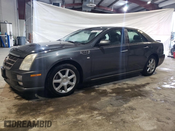 2010 Cadillac STS AWD z VIN 1G6DU6EV5A0113671, wystawiony jako Copart lot #47447395 z przebiegiem 77 062 mil mil oraz Tytuł czysty. Historia ofert i sprzedaży dostępna na DreamBid. Obrazek 1.