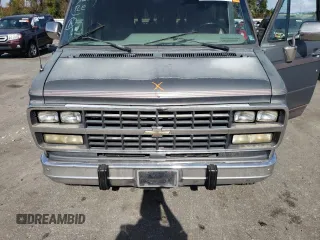1994 Chevrolet Chevy Van z VIN 1GBEG25K5RF123489, wystawiony jako Copart lot #79491854 z przebiegiem 82 970 mil mil oraz Szkoda całkowita • Salvage title. Historia ofert i sprzedaży dostępna na DreamBid. Obrazek 12.