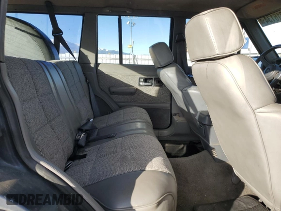 1992 Jeep Cherokee with VIN 1J4FJ58S7NL136135, listed as a Copart auction lot 86016134 with 160,259 mi miles and Clean title. Bid and sale history available at DreamBid. Image 11.