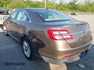 2015 Ford Taurus SEL z VIN 1FAHP2E84FG125243, wystawiony jako IAAI lot #42045847 z przebiegiem 42 093 mil mil oraz . Historia ofert i sprzedaży dostępna na DreamBid. Obrazek 3.