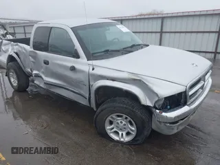 2001 Dodge Dakota Sport z VIN 1B7GG22N31S316805, wystawiony jako IAAI lot #42114986 z przebiegiem 91 402 mil mil oraz . Historia ofert i sprzedaży dostępna na DreamBid. Obrazek 1.