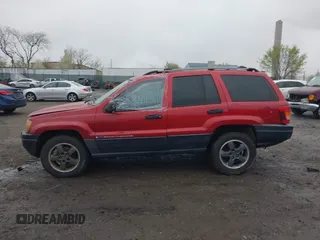 2004 Jeep Grand Cherokee Laredo with VIN 1J4GW48S94C151816, listed as a IAAI auction lot 41983332 with 151,227 mi miles. Bid and sale history available at carsss.com. Image 14.