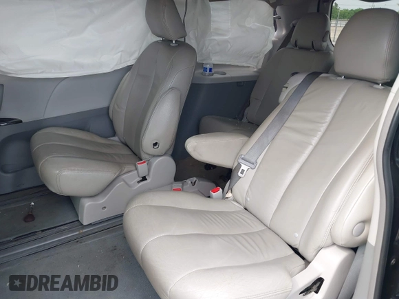 2014 Toyota Sienna LE AAS z VIN 5TDKK3DC1ES506563, wystawiony jako IAAI lot #42108481 z przebiegiem 173 831 mil mil oraz . Historia ofert i sprzedaży dostępna na DreamBid. Obrazek 8.