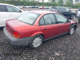 1997 Saturn SL with VIN 1G8ZF5289VZ138039, listed as a IAAI auction lot 39432871 with 125,022 mi miles. Bid and sale history available at carsss.com. Image 4.