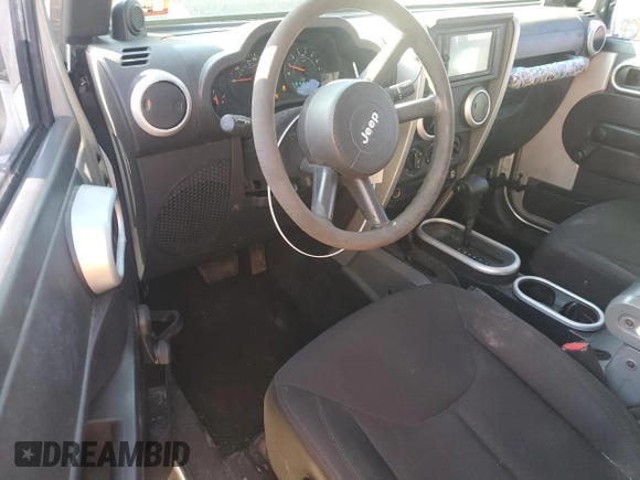2009 Jeep Wrangler X with VIN 1J4FA24119L729880, listed as a Copart auction lot 54576155 with 173,959 mi miles and Clean Title. Bid and sale history available at DreamBid. Image 8.