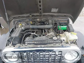 2006 Jeep Wrangler Sport Right Hand Drive with VIN 1J4F449S06P725862, listed as a IAAI auction lot 41562989 with 121,997 mi miles. Bid and sale history available at carsss.com. Image 10.